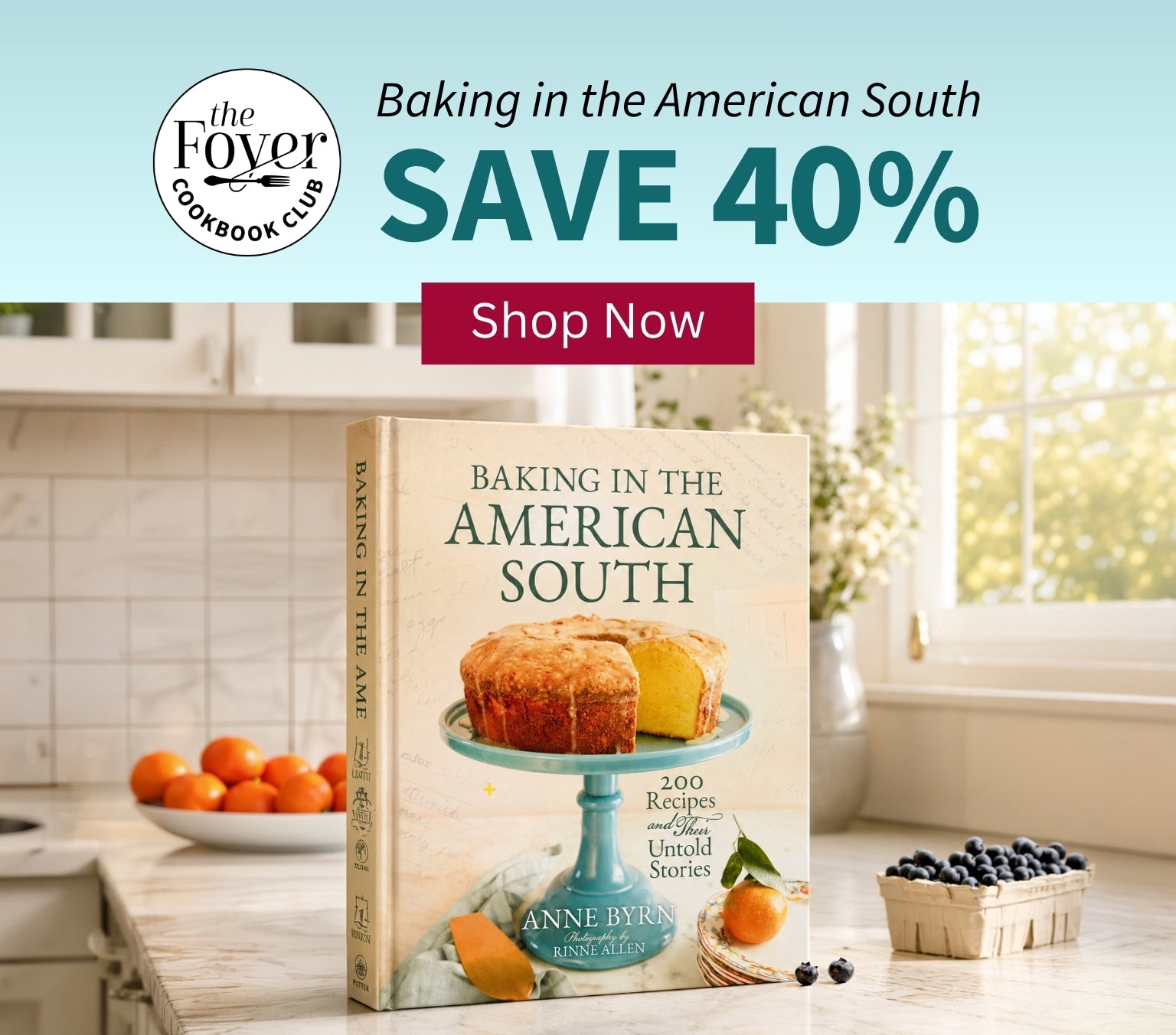 Book titled 'Baking in the American South' on a kitchen counter with promotional text for The Foyer Cookbook Club.
